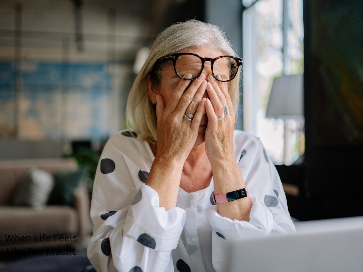 Woman with hand over her face in frustration and overwhelm