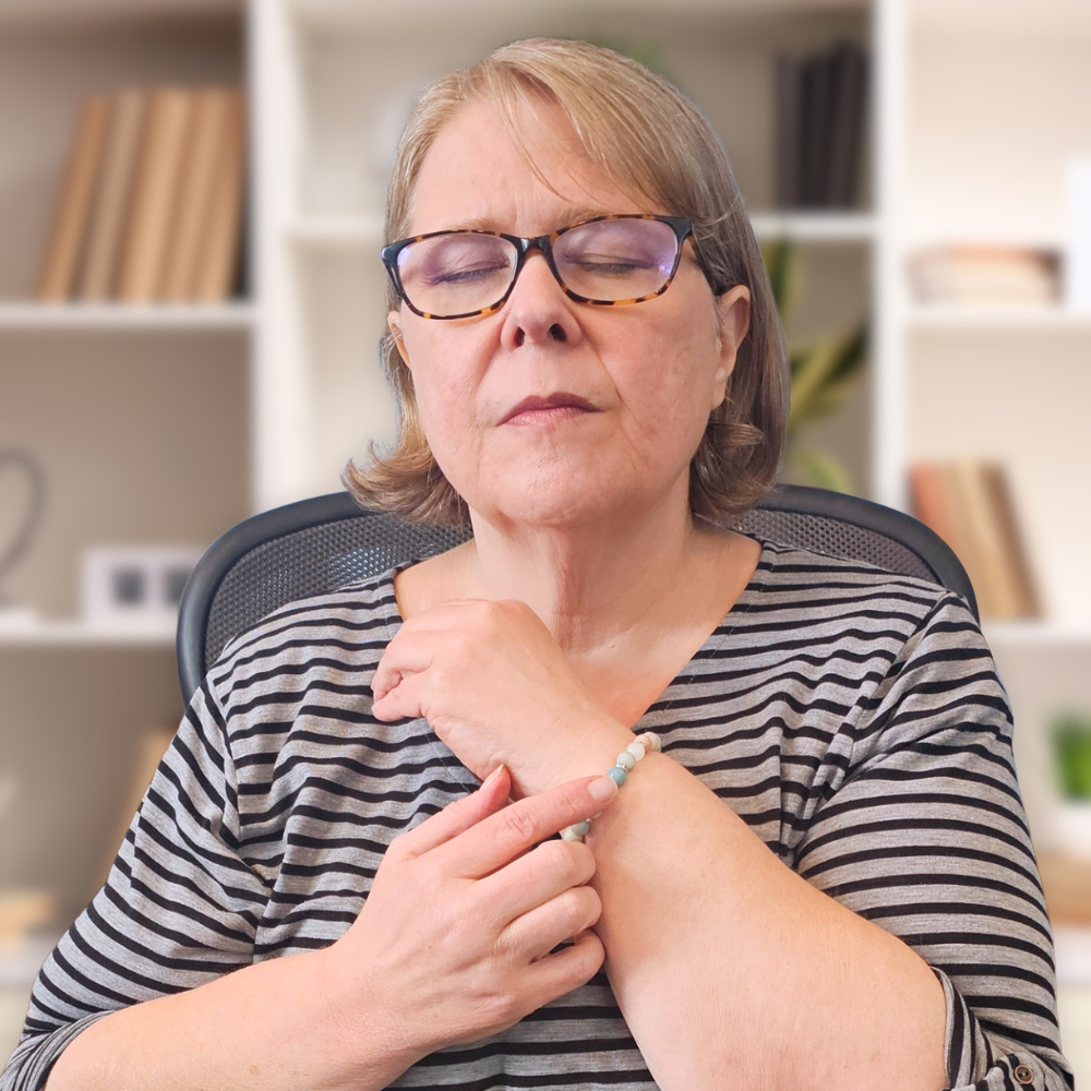 woman usng the grounding bracelet to calm down